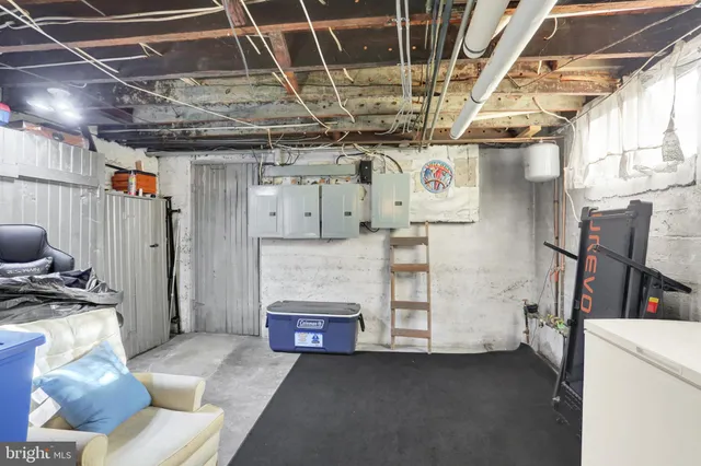 a bedroom with furniture and a flat screen tv