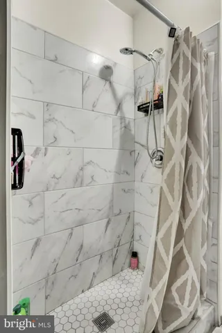 a living room with furniture and a kitchen