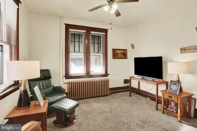 a bedroom with a bed and a rug