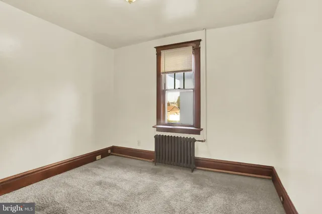 a view of staircase with wooden floor and stairs