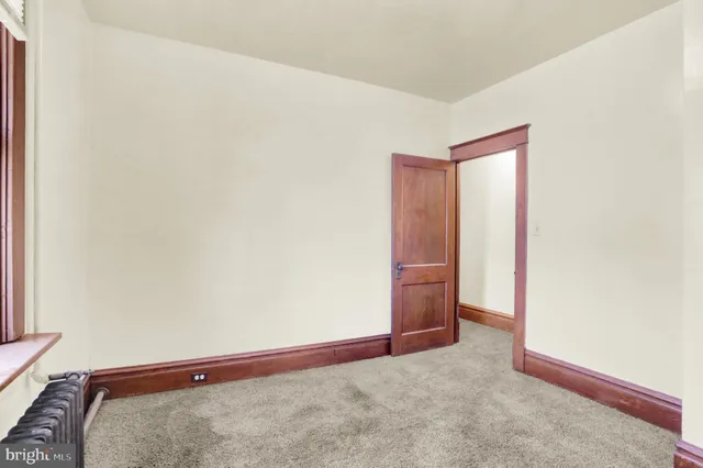 a view of a house with a large space and a yard