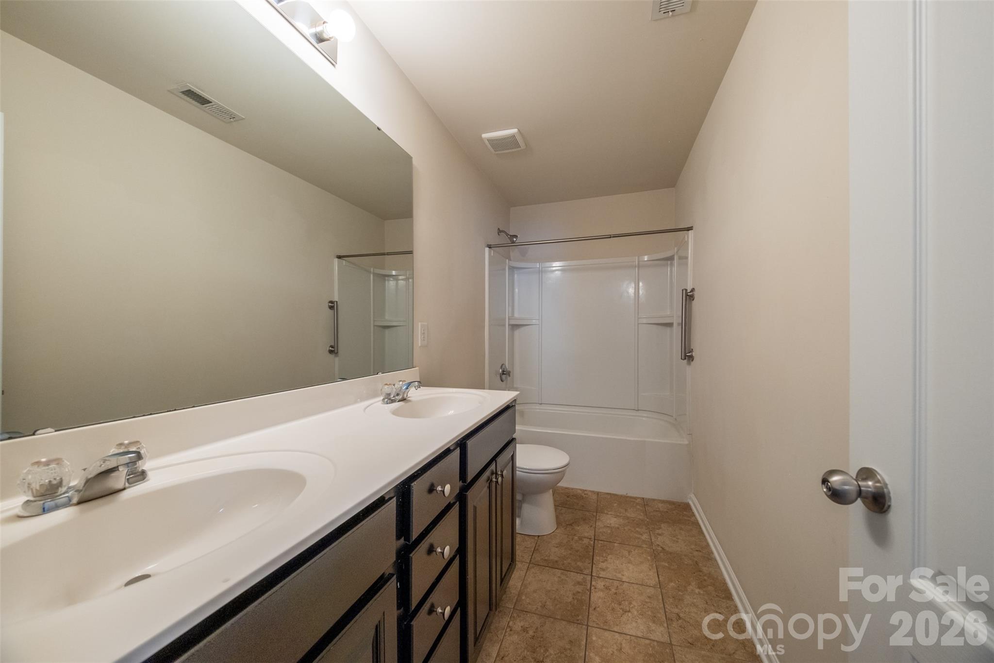 3006 Houndscroft Road Indian Trail, NC 28079 - Photo 30 of 39 a bathroom with a sink a toilet and shower