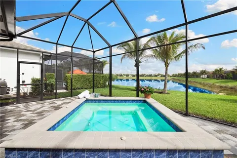a view of swimming pool with outdoor seating