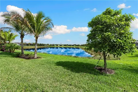 a view of a swimming pool with an outdoor seating