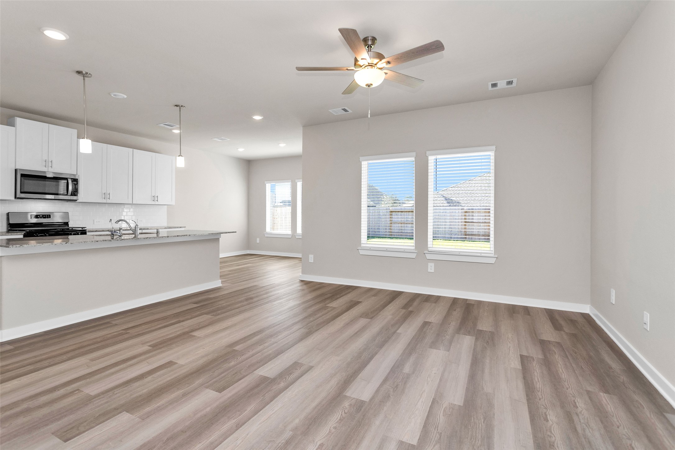 1406 Waggoner Rnch Trail Conroe, TX 77301 - Photo 11 of 43 a view of a kitchen with microwave and cabinets