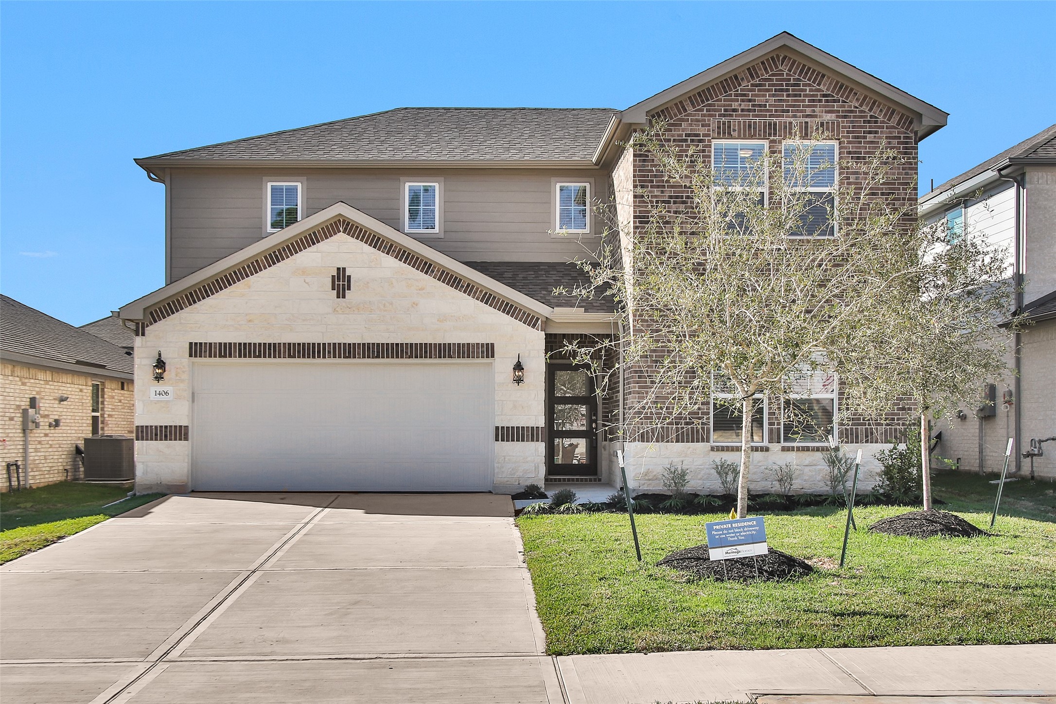 1406 Waggoner Rnch Trail Conroe, TX 77301 - Photo 2 of 43 a front view of a house with a yard