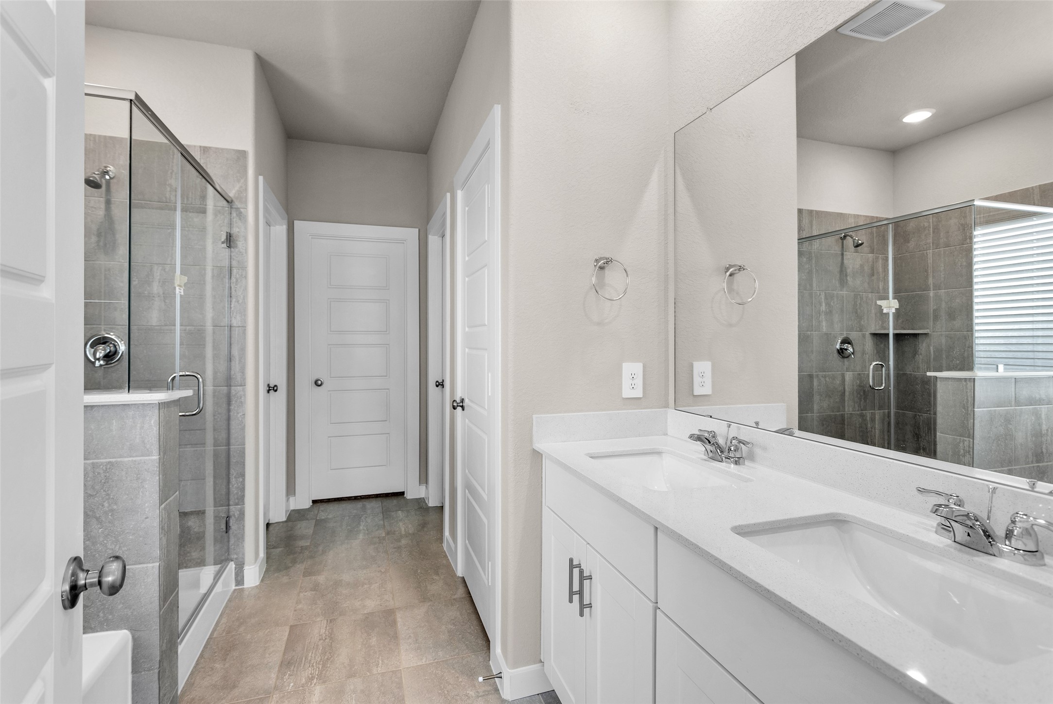 1406 Waggoner Rnch Trail Conroe, TX 77301 - Photo 23 of 43 a bathroom with a double vanity sink mirror and double