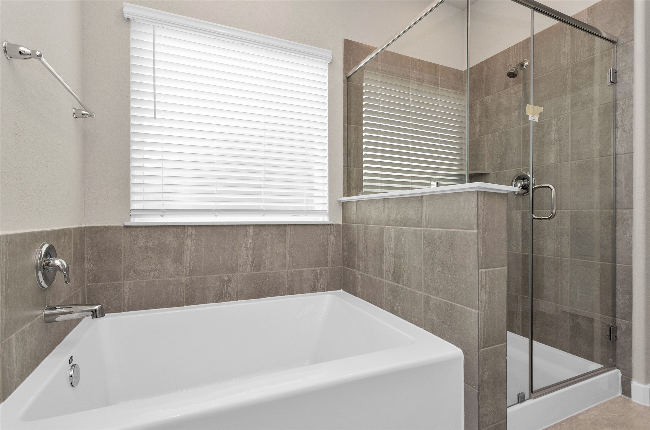 1406 Waggoner Rnch Trail Conroe, TX 77301 - Photo 24 of 43 a bathroom with a bathtub and a shower