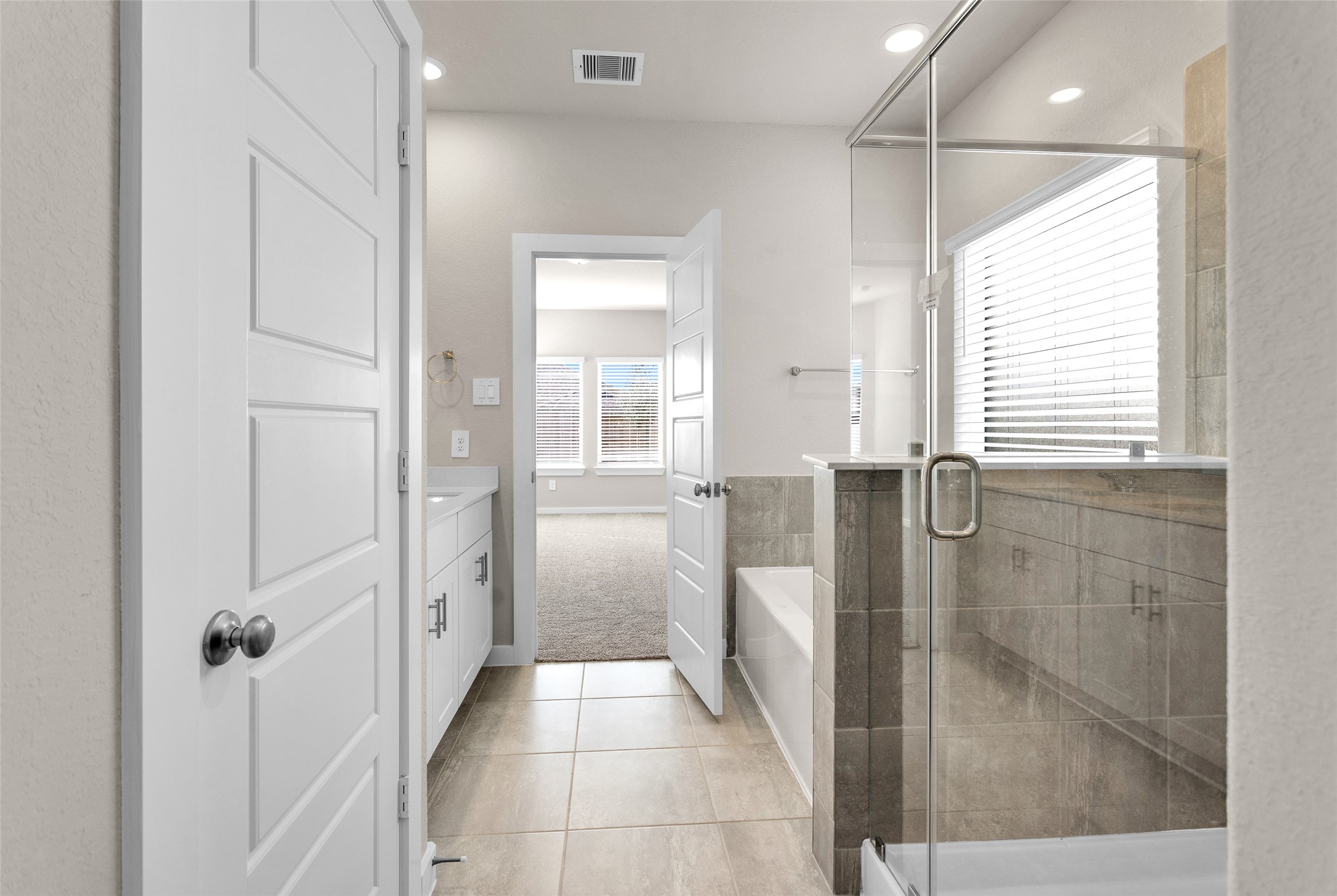 1406 Waggoner Rnch Trail Conroe, TX 77301 - Photo 25 of 43 a bathroom with a shower and a sink