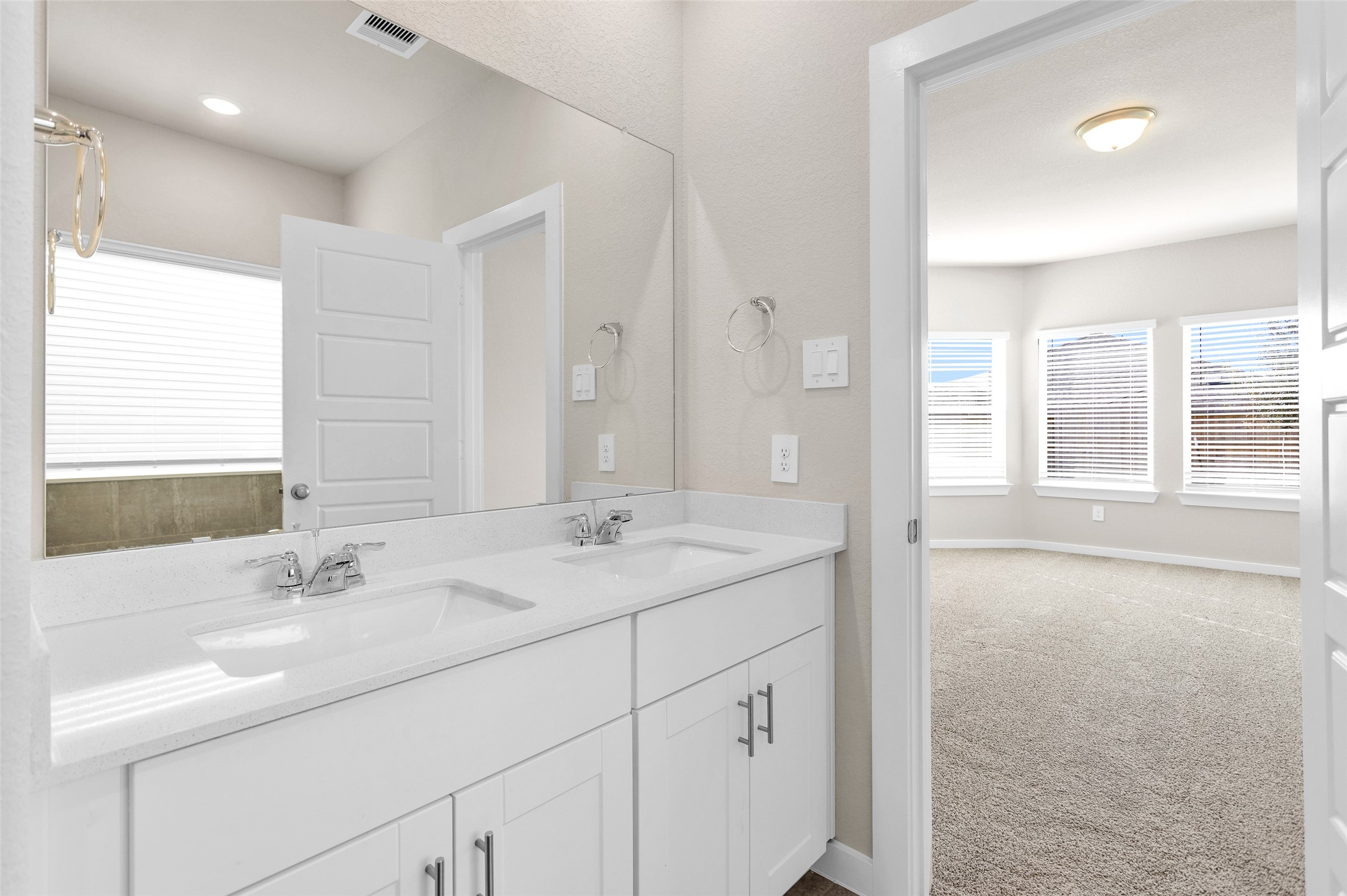 1406 Waggoner Rnch Trail Conroe, TX 77301 - Photo 26 of 43 a bathroom with a sink double vanity and a mirror