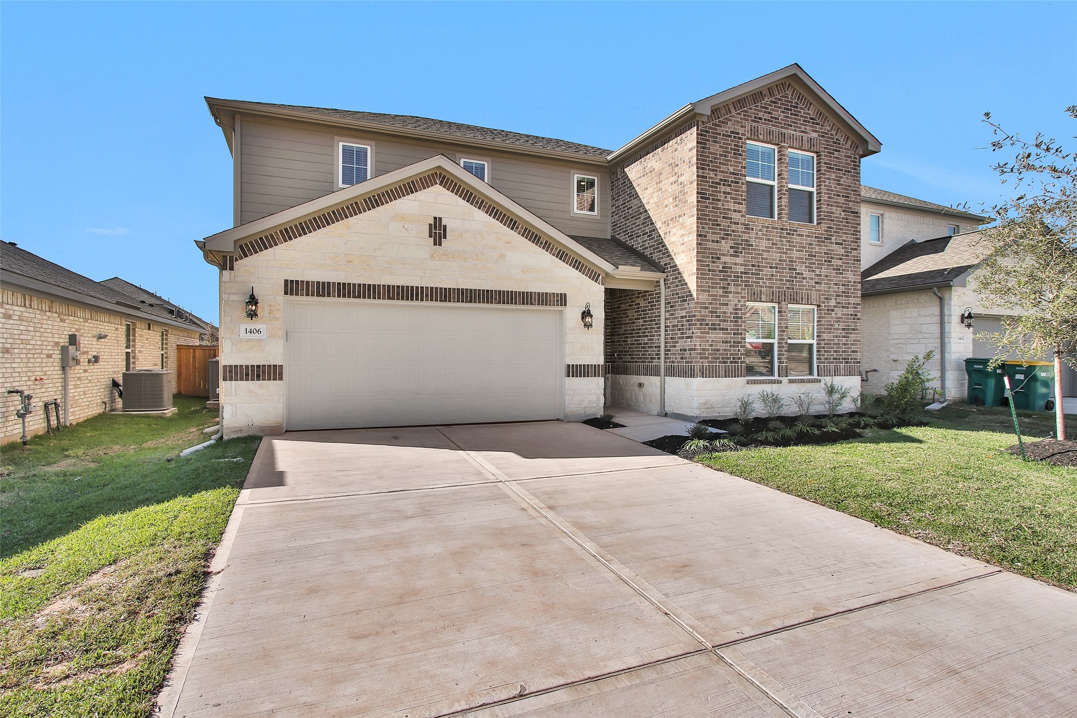 1406 Waggoner Rnch Trail Conroe, TX 77301 - Photo 3 of 43 a front view of a house with a yard