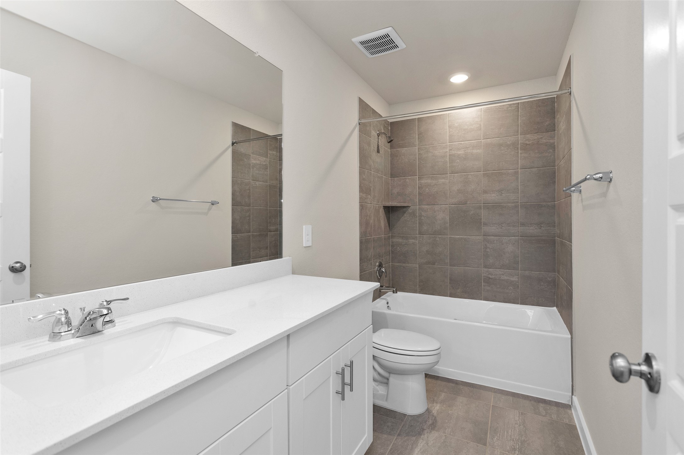 1406 Waggoner Rnch Trail Conroe, TX 77301 - Photo 35 of 43 a bathroom with a bathtub shower sink mirror vanity and toilet