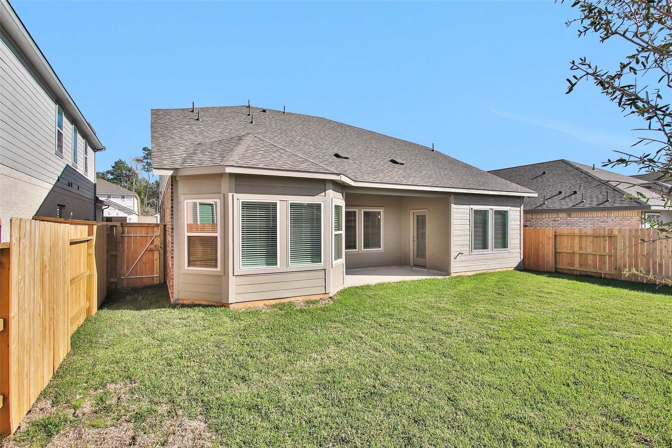 1406 Waggoner Rnch Trail Conroe, TX 77301 - Photo 40 of 43 a view of a house with a yard