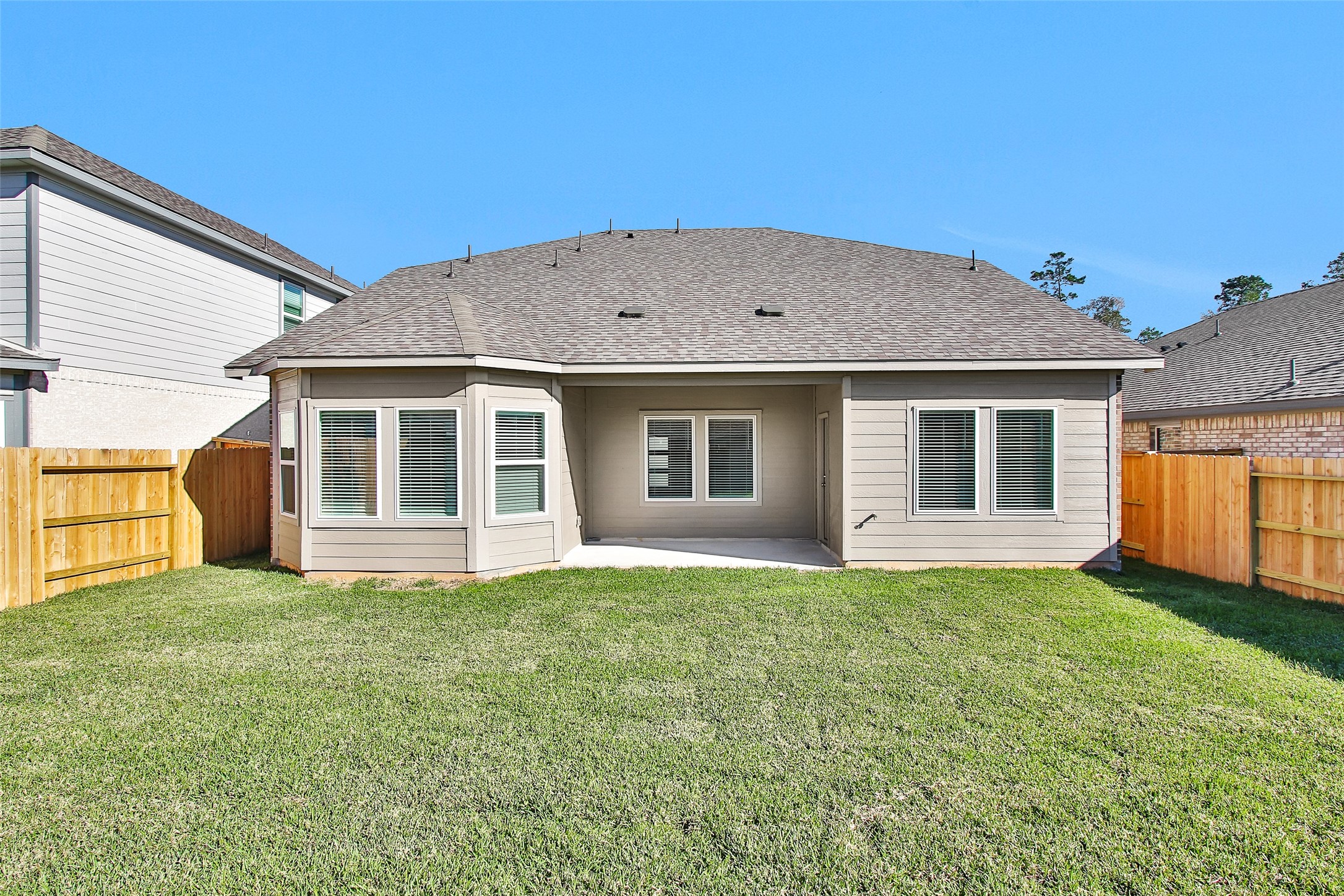 1406 Waggoner Rnch Trail Conroe, TX 77301 - Photo 41 of 43 a house that has a big yard in front of it