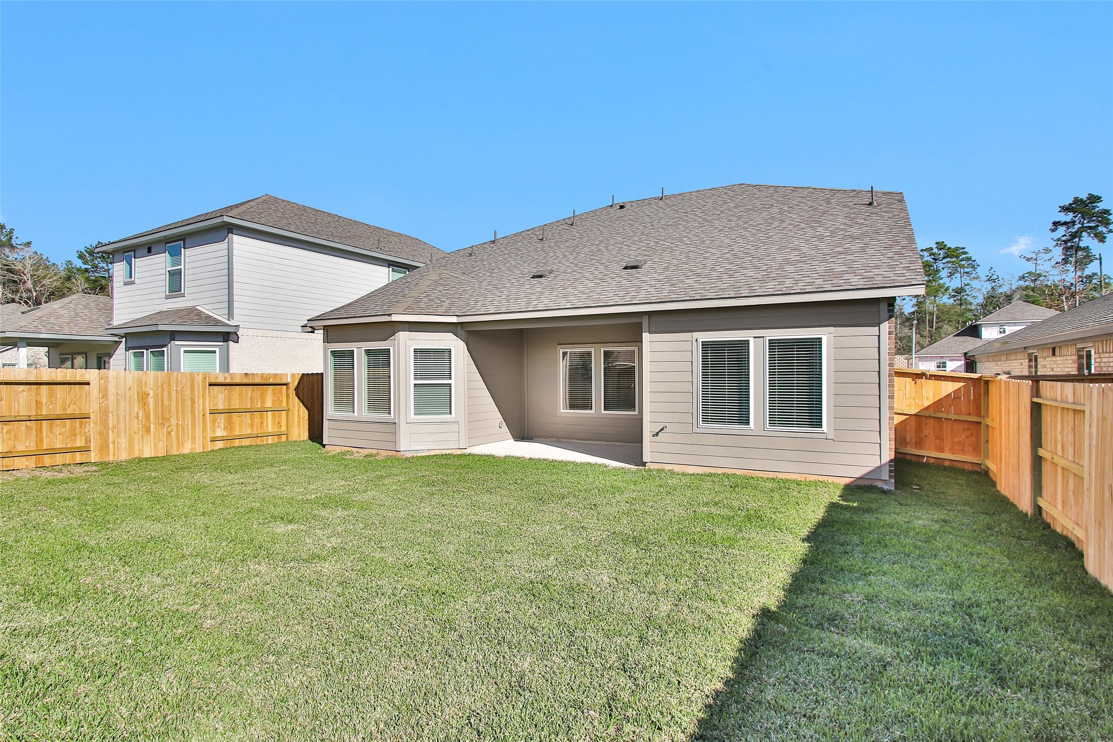 1406 Waggoner Rnch Trail Conroe, TX 77301 - Photo 42 of 43 a front view of a house with a yard and garage