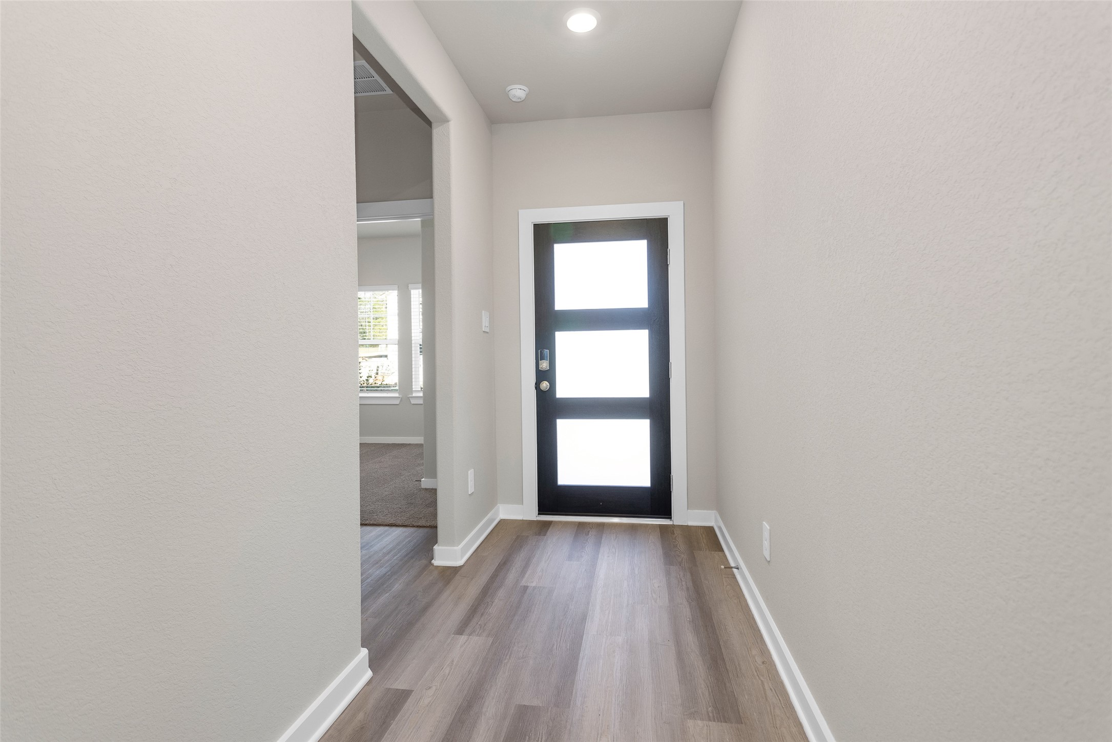 1406 Waggoner Rnch Trail Conroe, TX 77301 - Photo 6 of 43 a view of empty room with wooden floor and fan