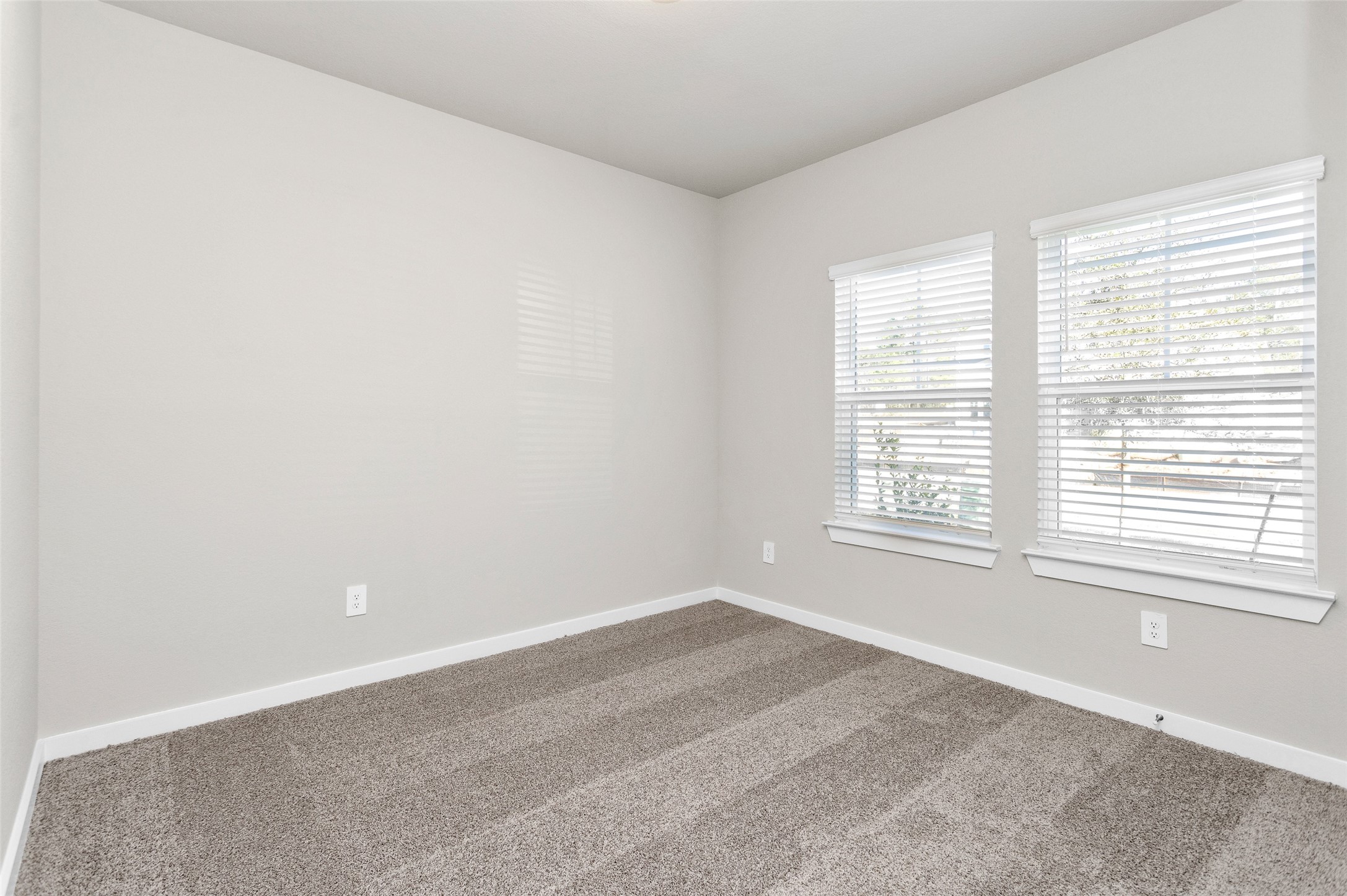 1406 Waggoner Rnch Trail Conroe, TX 77301 - Photo 7 of 43 a room with a window and a ceiling fan