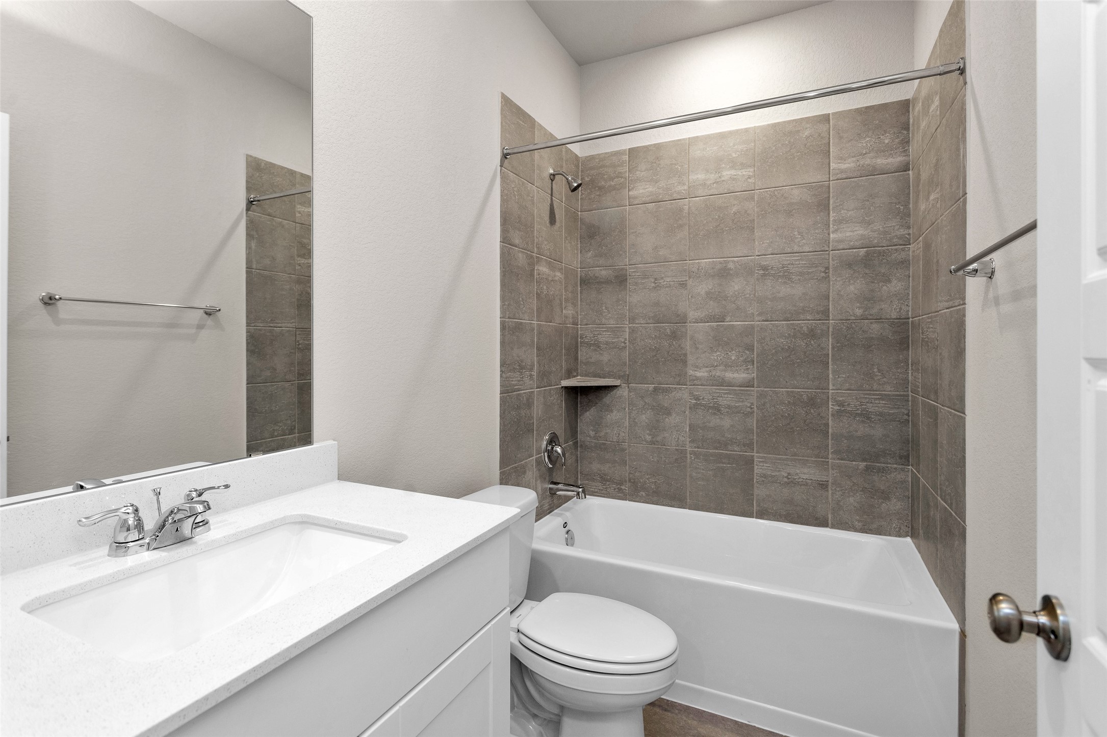 1406 Waggoner Rnch Trail Conroe, TX 77301 - Photo 10 of 43 a bathroom with a granite countertop bathtub shower sink vanity and toilet