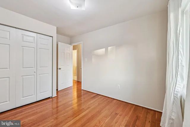 a view of room with window and hardwood floor