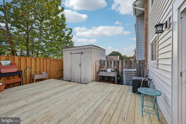 a view of a house with wooden deck