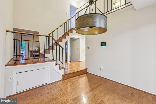 a view of a kitchen cabinets and wooden floor