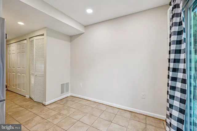 a kitchen with stainless steel appliances granite countertop a stove top oven a sink dishwasher and a refrigerator