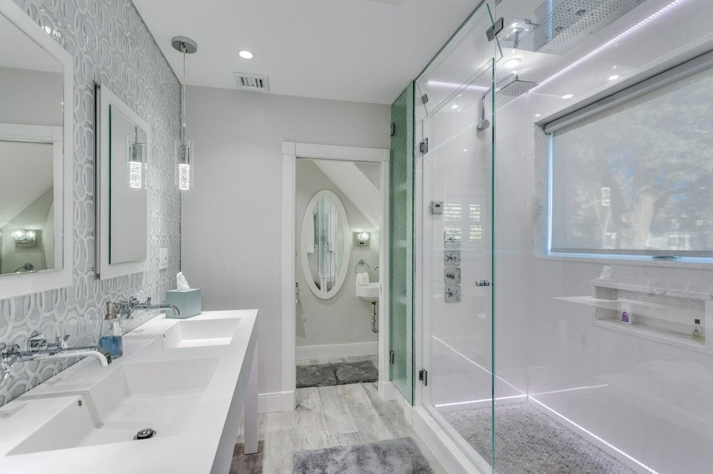 7 Brewer Street, Unit 2 Boston, MA 02130 - Photo 11 of 18 a bathroom with a sink a toilet and shower