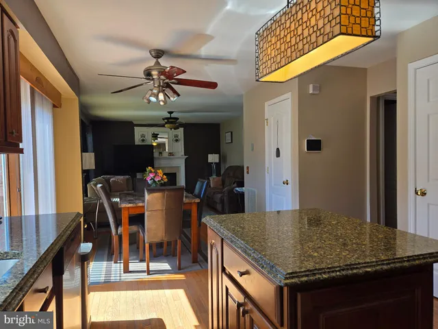 a bedroom with furniture and a large window