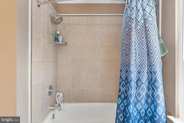 a bedroom with a bed and a chair