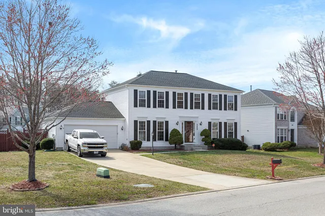 a view of a hallway and dining room with furniture