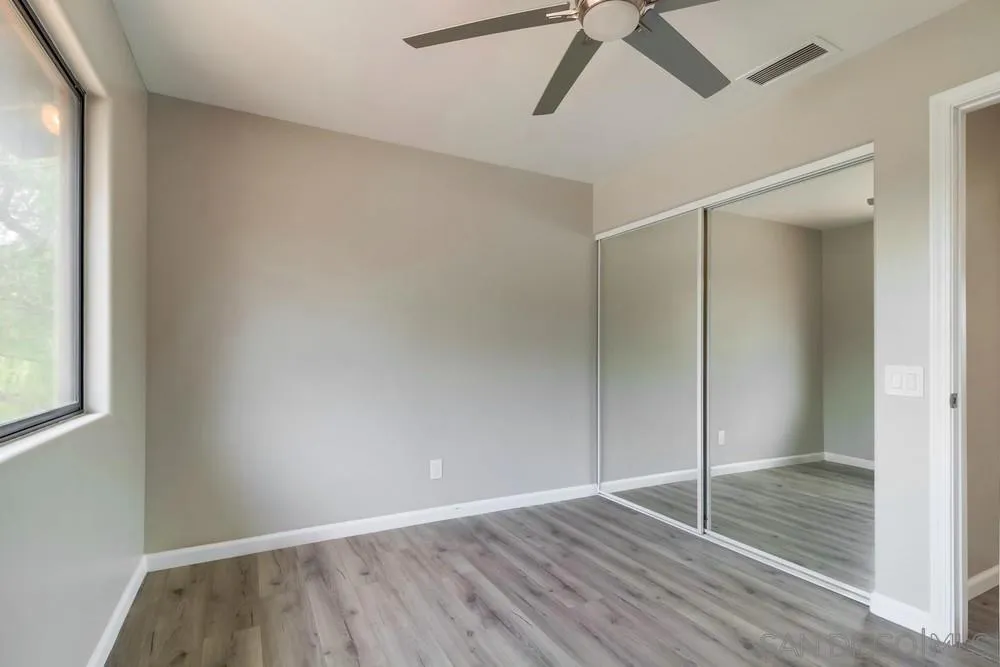 1660 Grove Road El Cajon, CA 92020 - Photo 17 of 44 a view of an empty room with wooden floor and a window