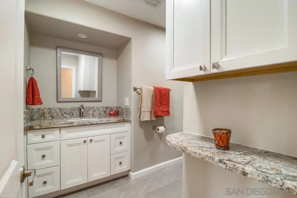 1660 Grove Road El Cajon, CA 92020 - Photo 29 of 44 a bathroom with a sink and a mirror
