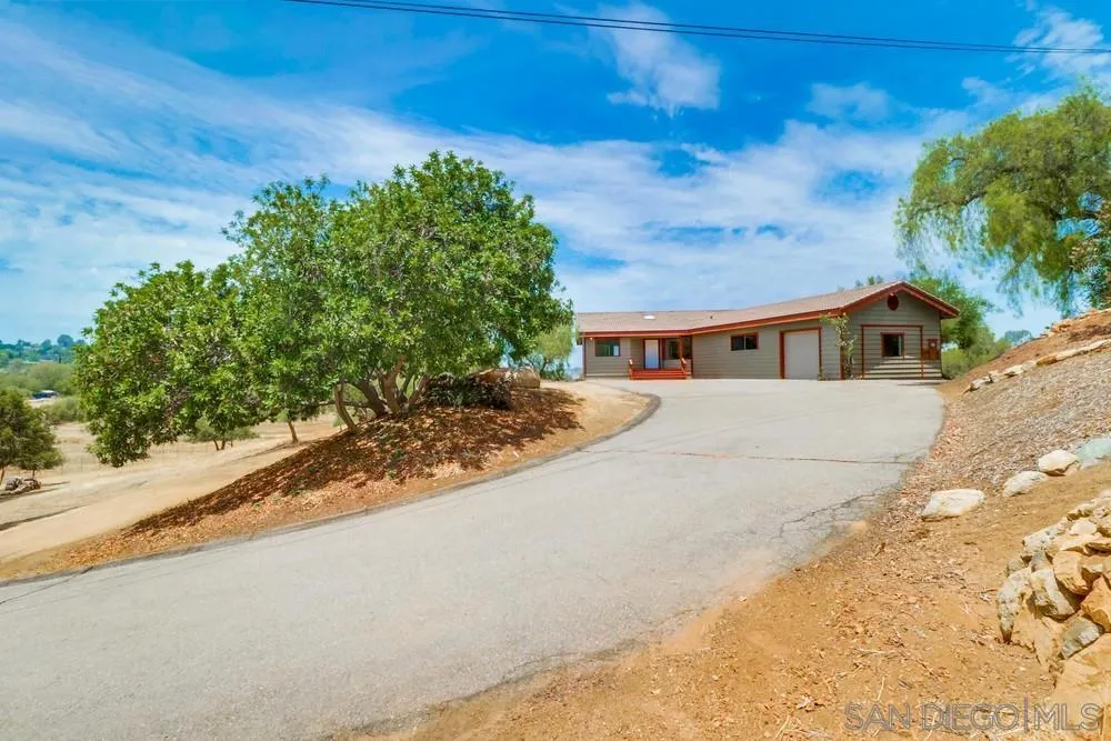 1660 Grove Road El Cajon, CA 92020 - Photo 34 of 44 a view of house with yard and trees in the background