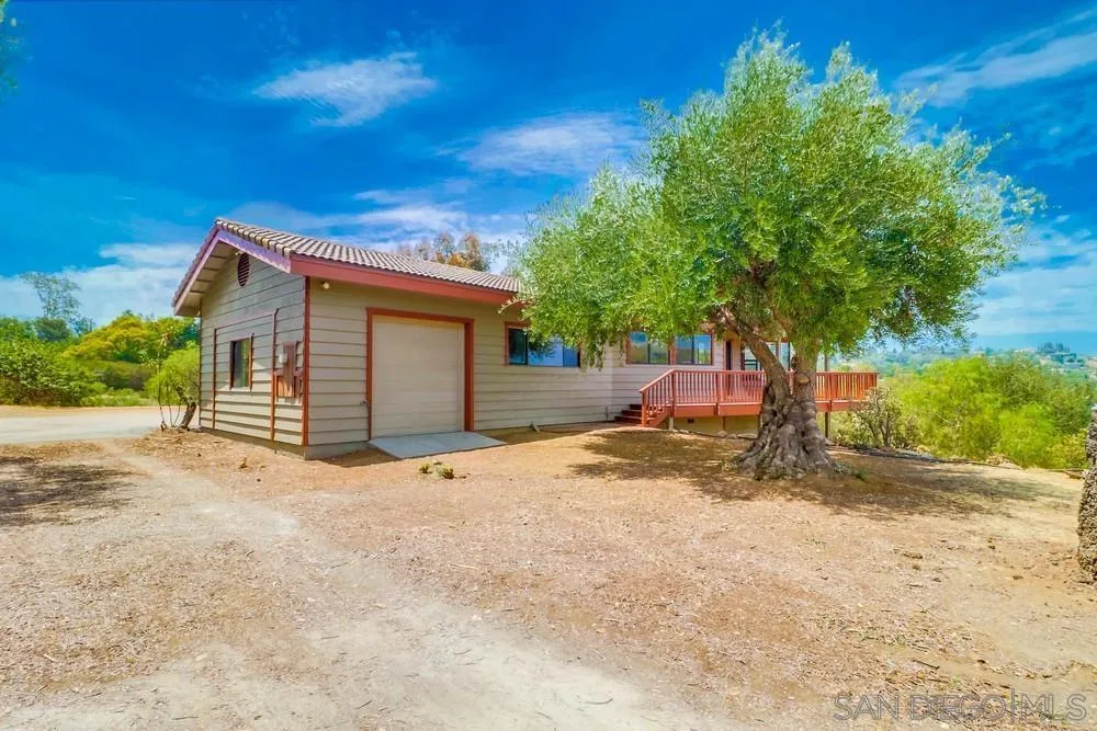1660 Grove Road El Cajon, CA 92020 - Photo 44 of 44 a view of a house with a yard and garage