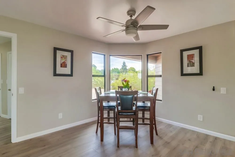 1660 Grove Road El Cajon, CA 92020 - Photo 7 of 44 a view of a dining room with furniture window and wooden floor