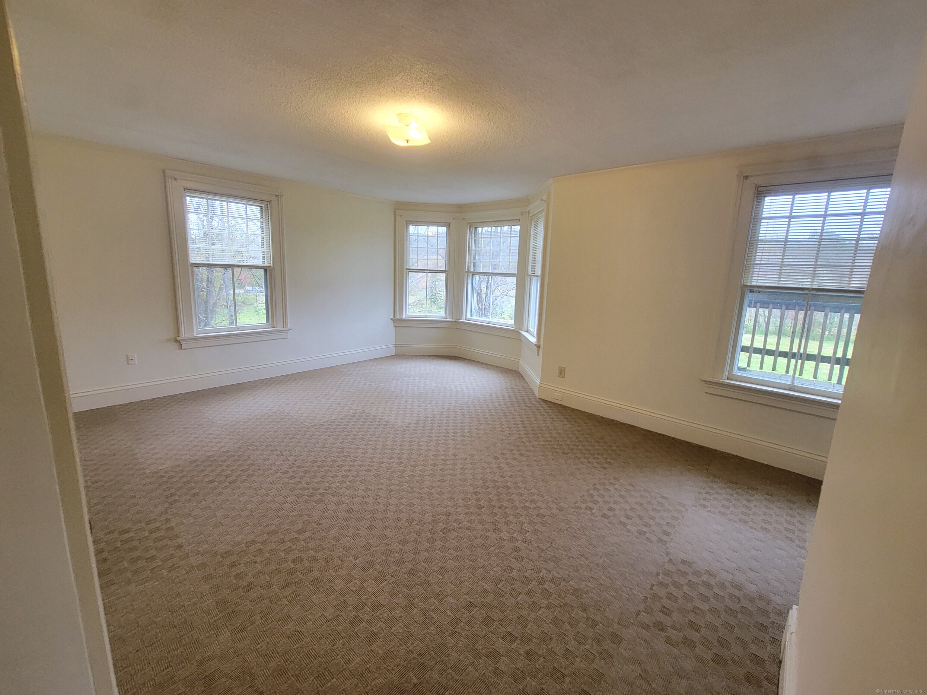 270 Cherry Brook Road, Unit 2 Canton, CT 06019 - Photo 12 of 14 an empty room with windows