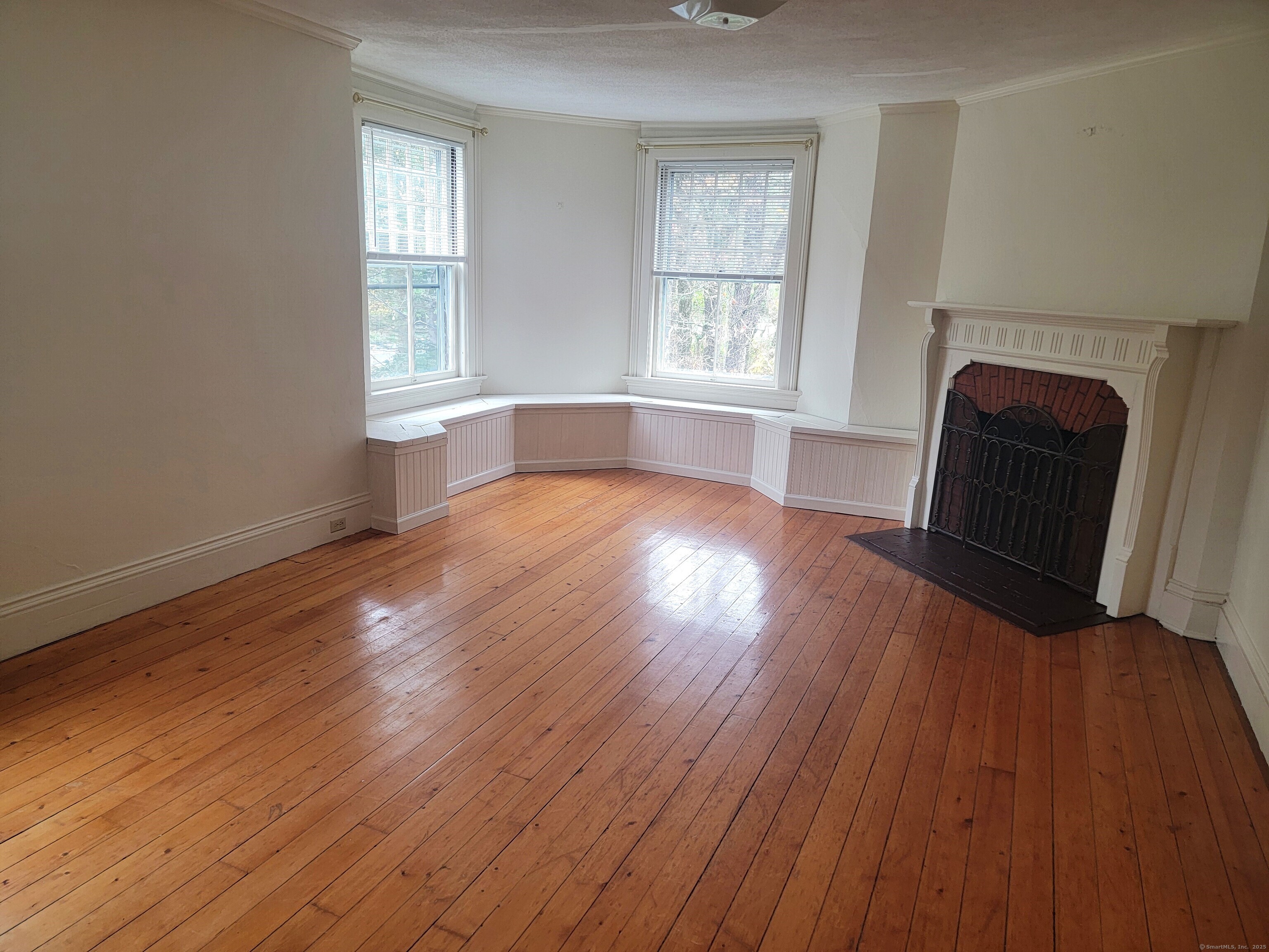 270 Cherry Brook Road, Unit 2 Canton, CT 06019 - Photo 3 of 14 an empty room with wooden floor and windows