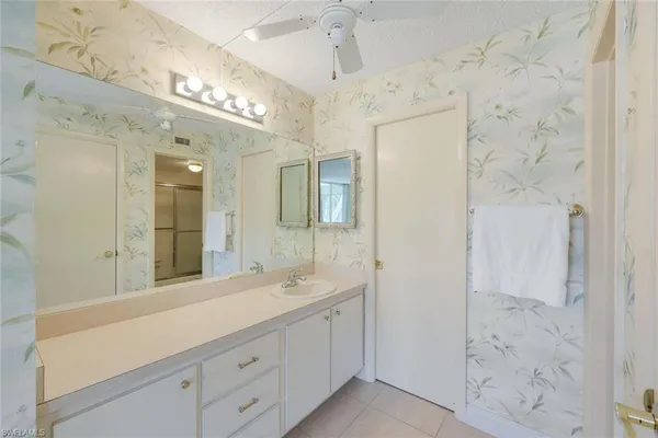 a bedroom with a bed and glass wall