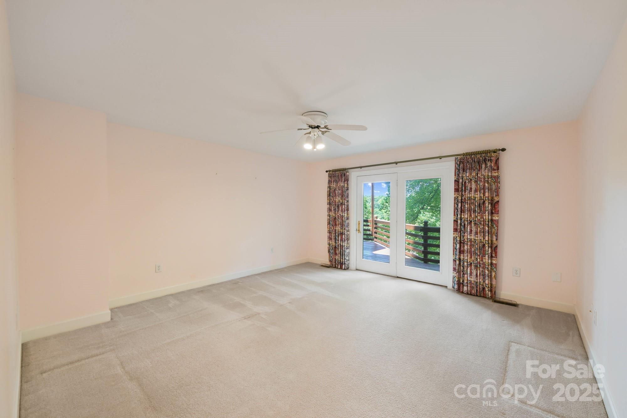 12041 Spinnaker Drive Tega Cay, SC 29708 - Photo 16 of 42 a view of an empty room with a window