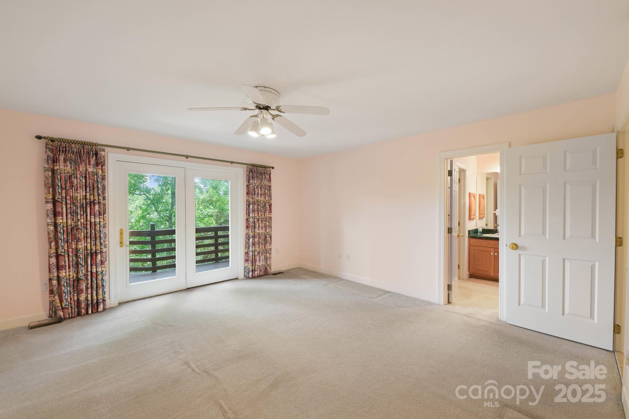 12041 Spinnaker Drive Tega Cay, SC 29708 - Photo 19 of 42 a view of an empty room with a window