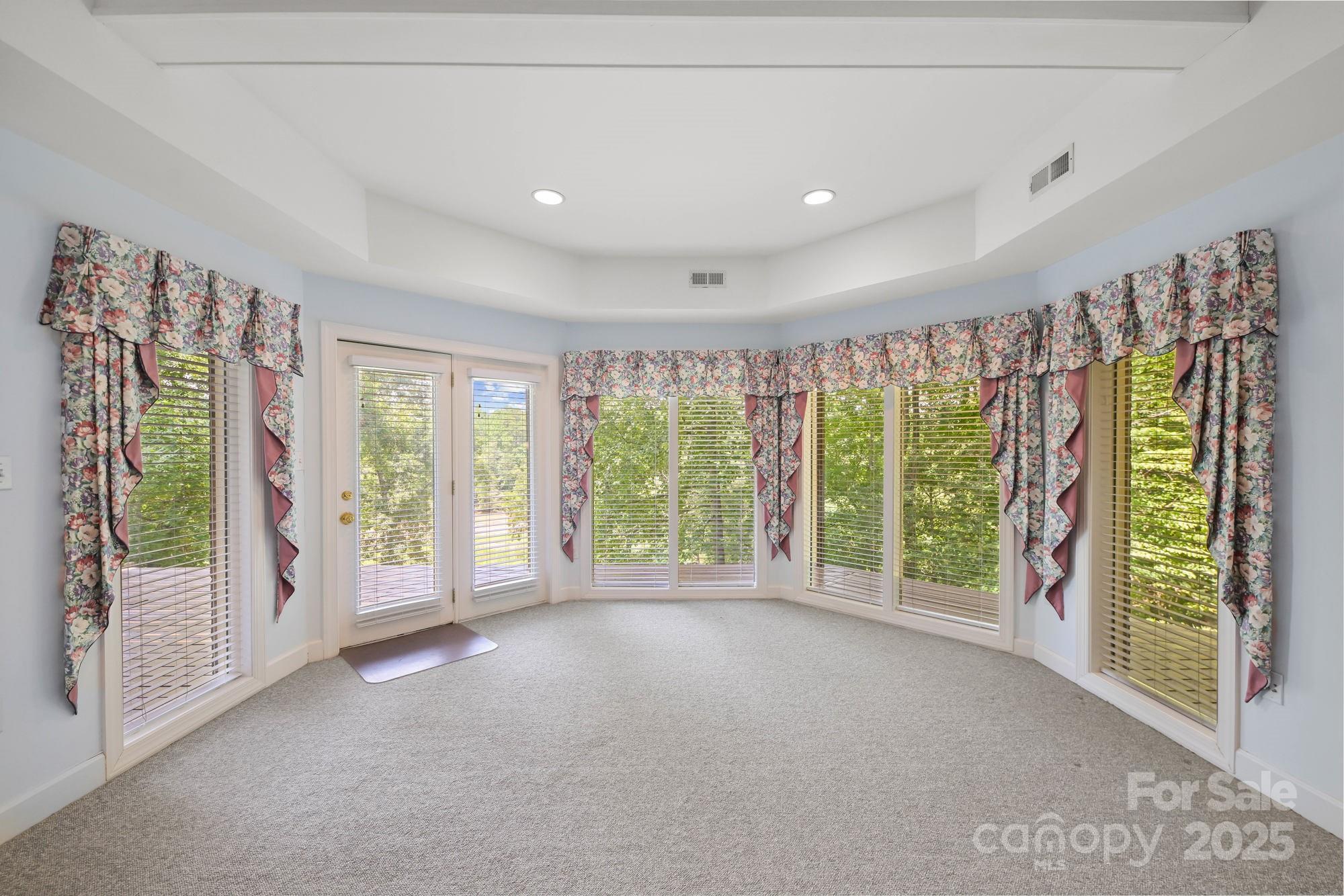 12041 Spinnaker Drive Tega Cay, SC 29708 - Photo 35 of 42 a view of an empty room with a window