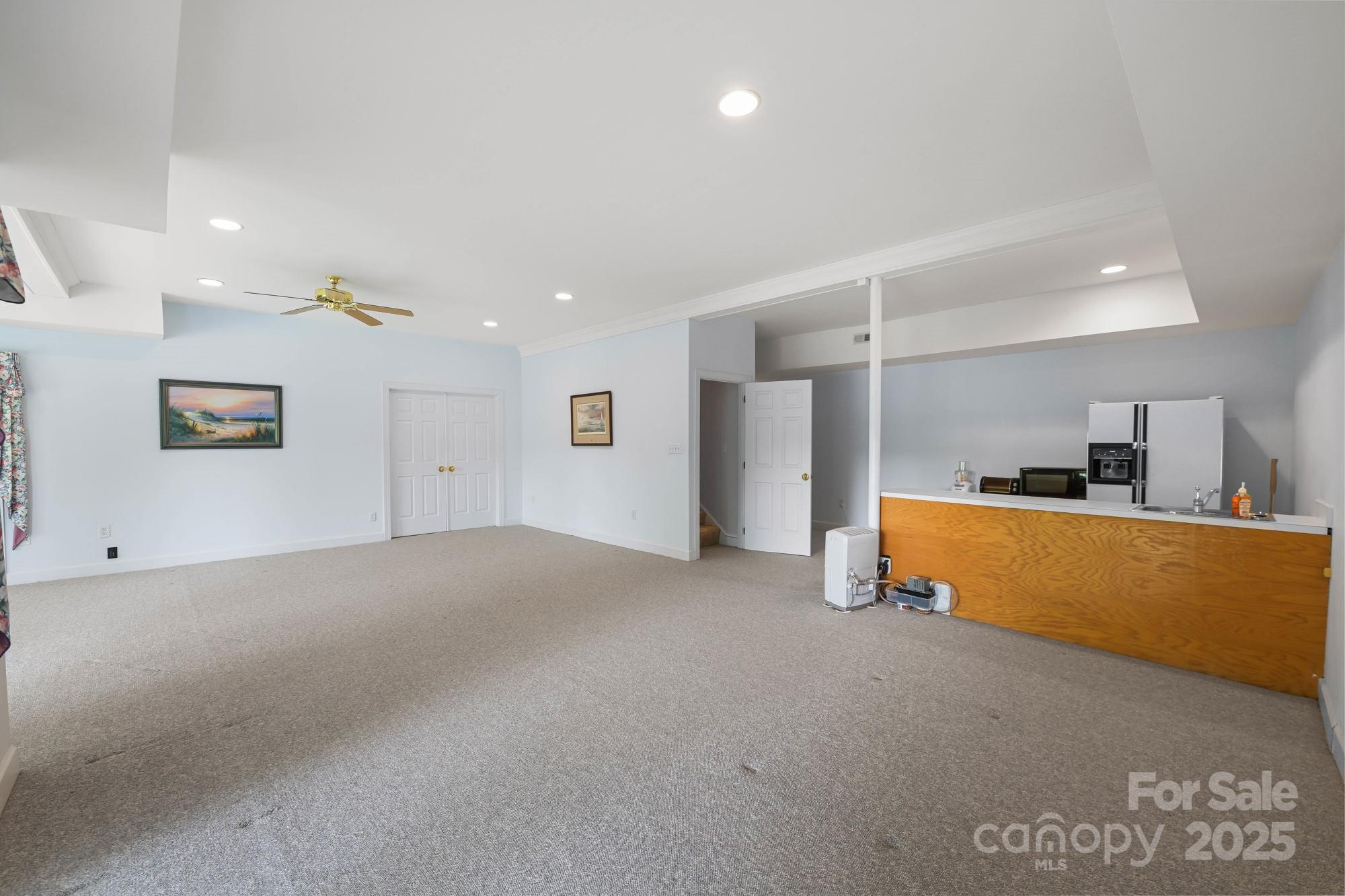 12041 Spinnaker Drive Tega Cay, SC 29708 - Photo 36 of 42 a view of kitchen and a livingroom with furniture