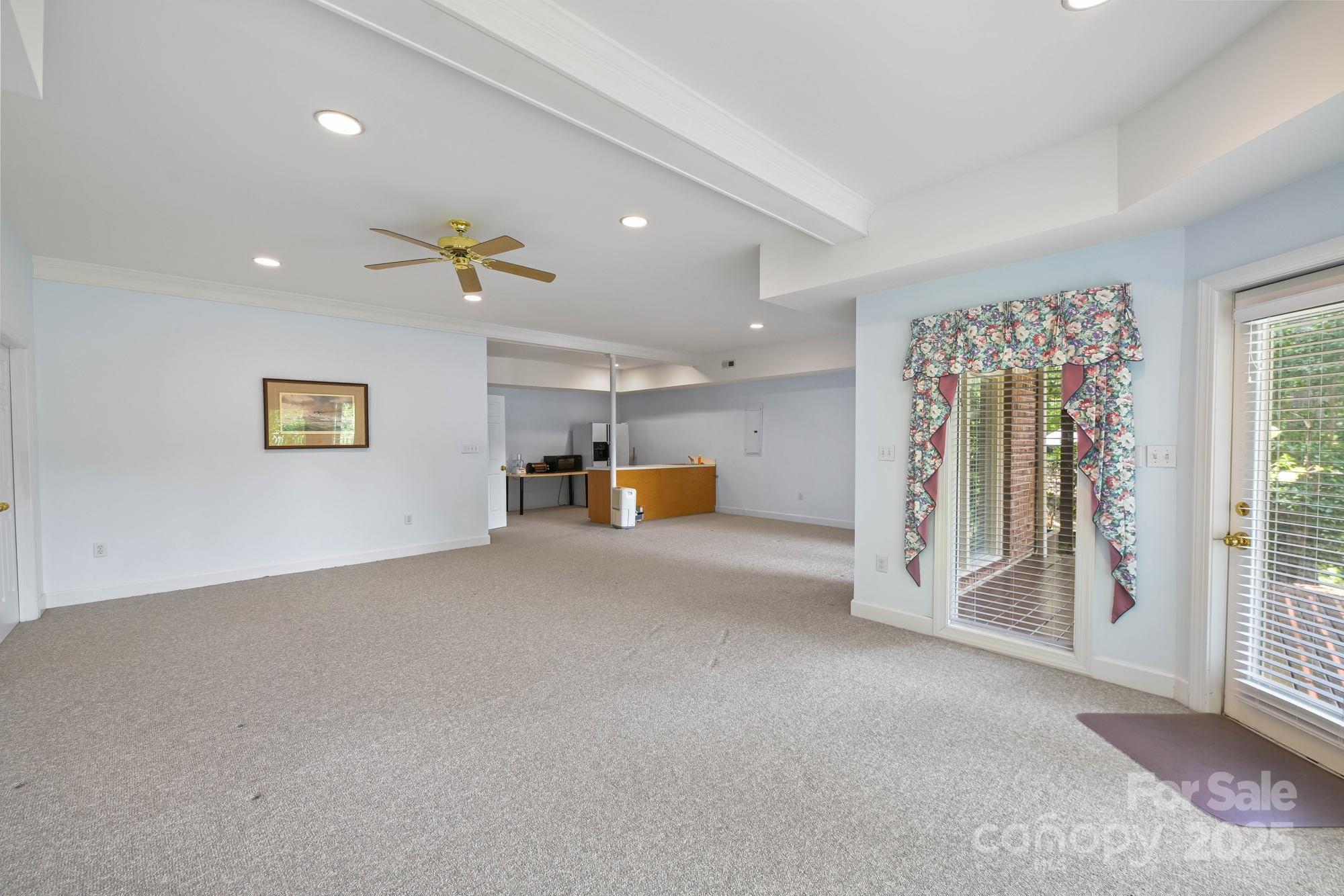 12041 Spinnaker Drive Tega Cay, SC 29708 - Photo 37 of 42 a view of livingroom with furniture and a ceiling fan