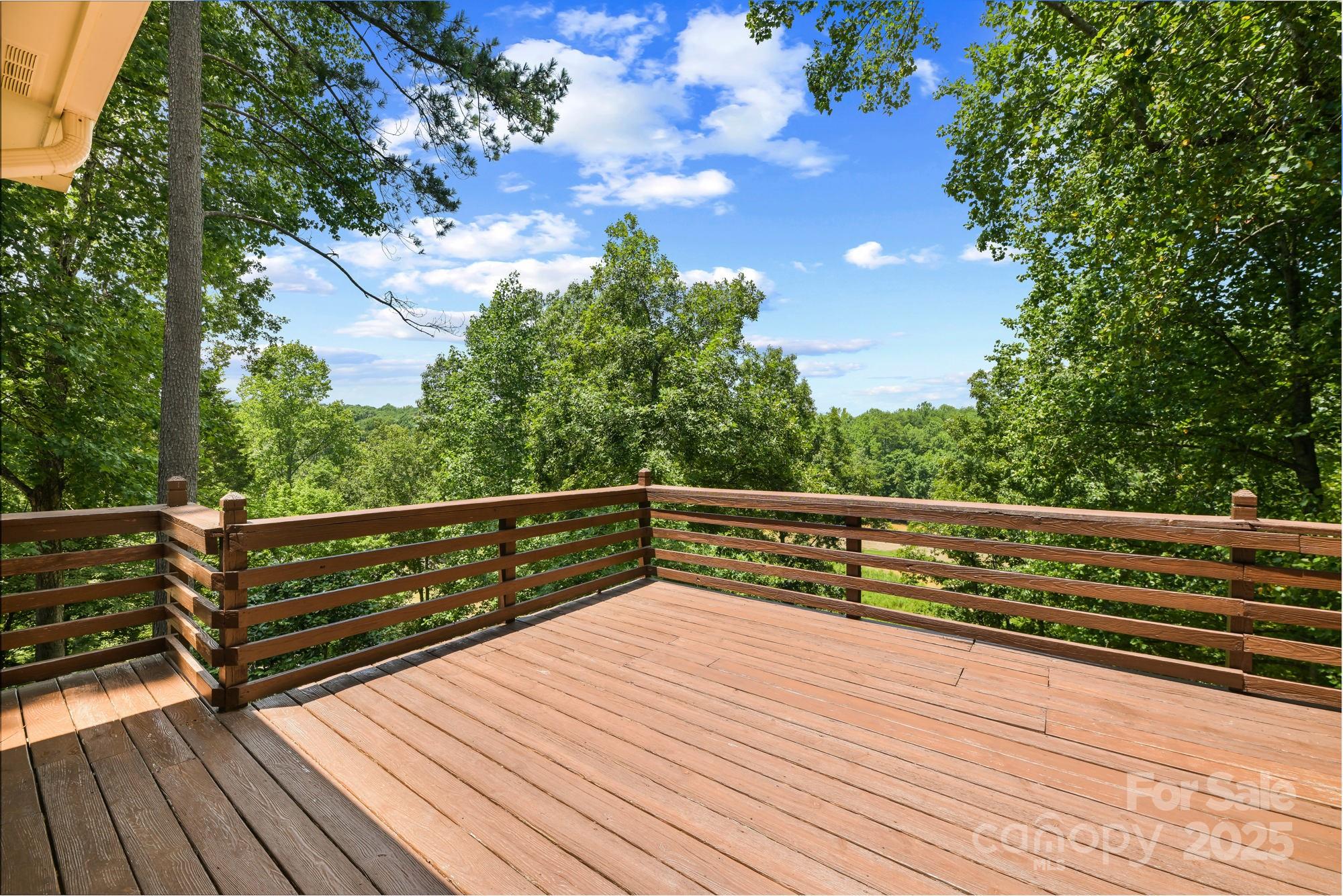 12041 Spinnaker Drive Tega Cay, SC 29708 - Photo 40 of 42 a view of outdoor space with wooden floor and fence