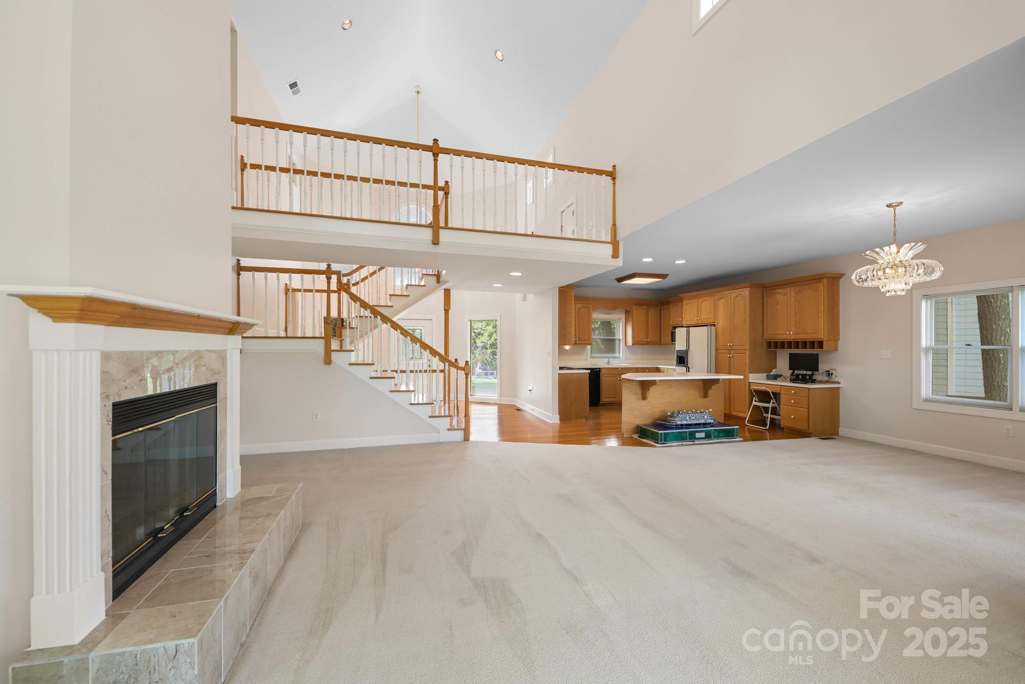 12041 Spinnaker Drive Tega Cay, SC 29708 - Photo 5 of 42 a view of a livingroom with furniture and a fireplace