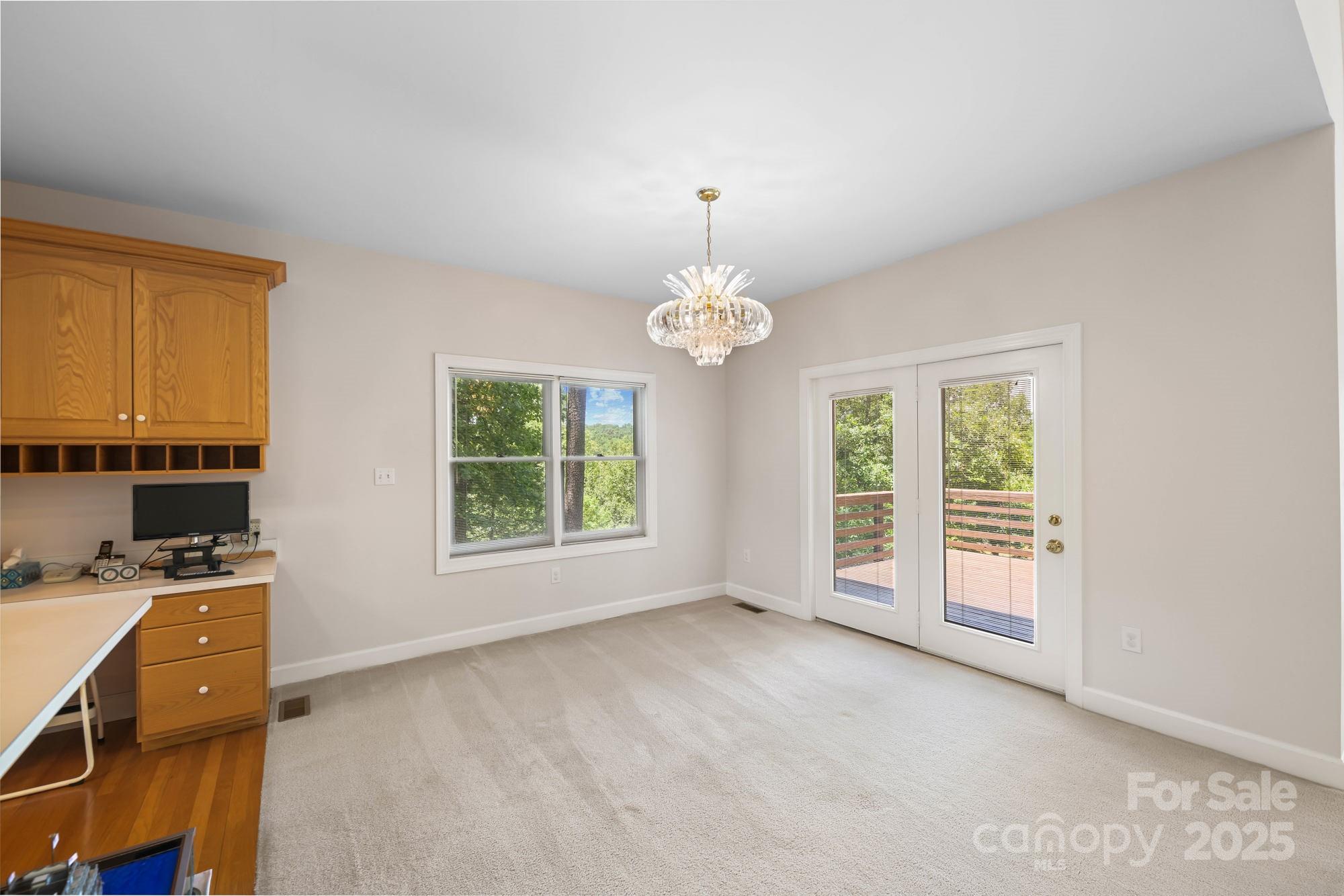 12041 Spinnaker Drive Tega Cay, SC 29708 - Photo 9 of 42 a view of workspace with furniture and window