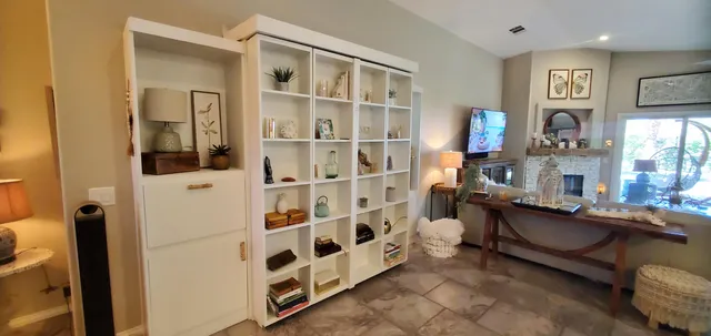 a view of living room with furniture and window