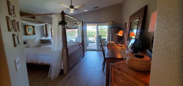 a hallway with furniture and a fireplace