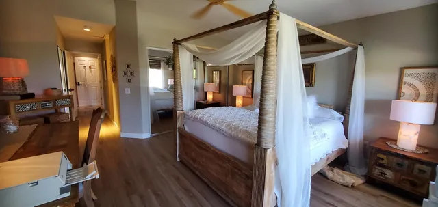 a view of living room with furniture and wooden floor