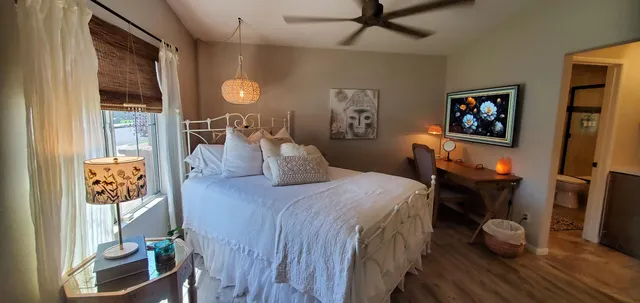 a bed room with a bed and a lamp